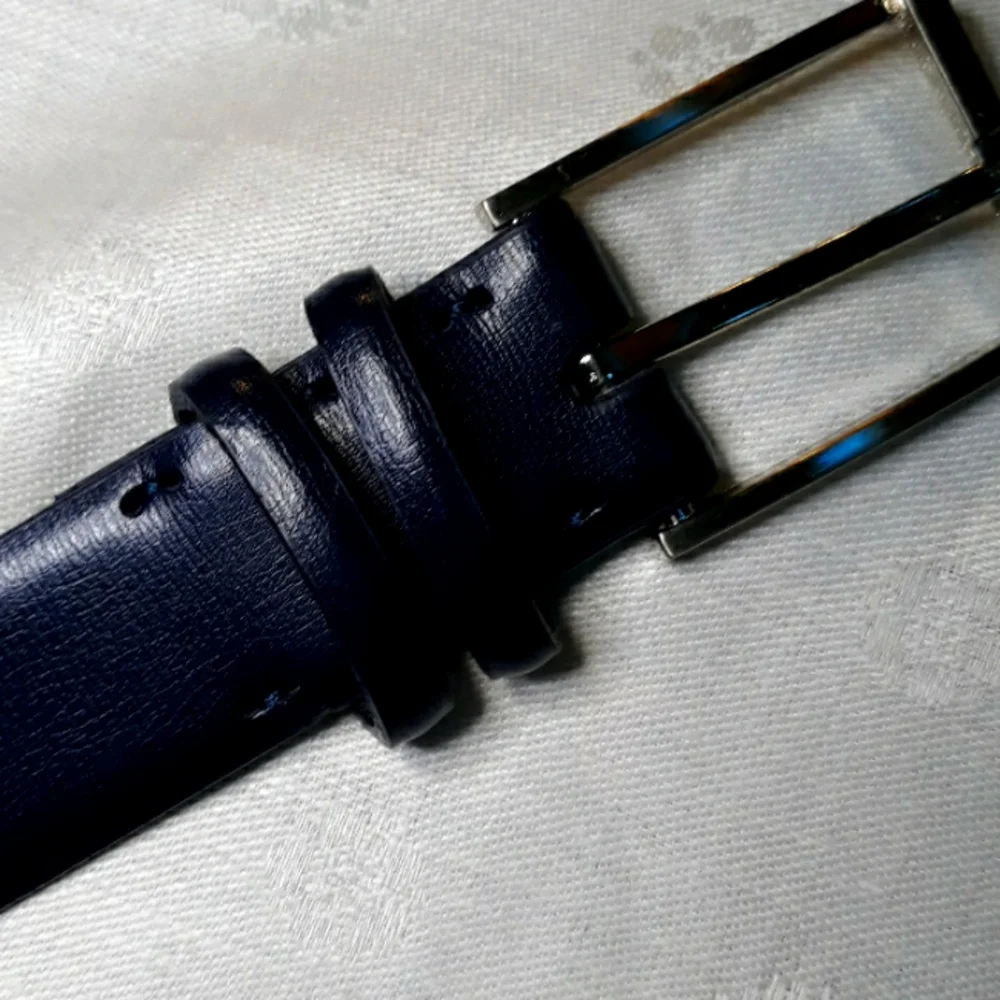 Calvin Klein dark blue leather belt. 34 inches long